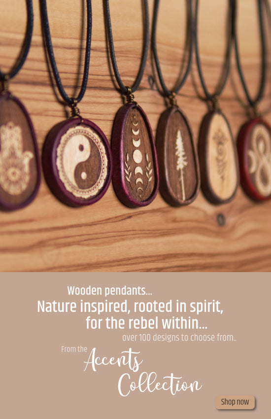 Photo of a collection of wooden pendants that have been inspired by nature, made from exotic woods.