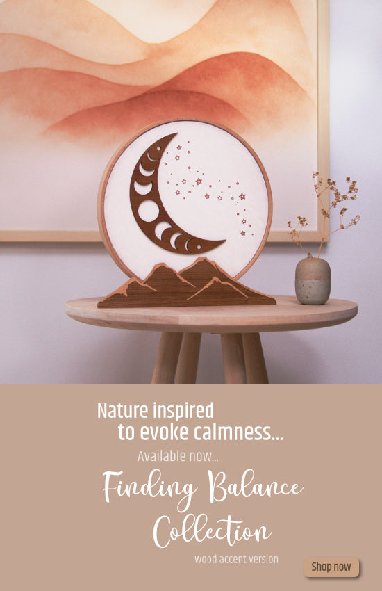 Photo of a handmade wooden table lamp, calming, nature inspired.